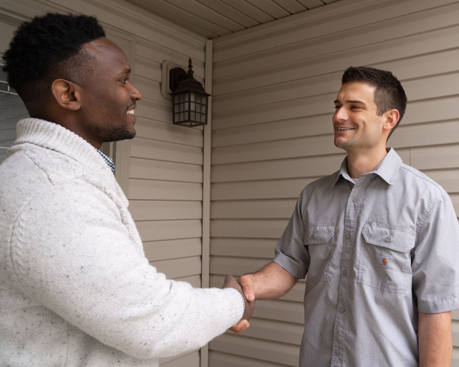 Chase Grimm shaking hands with his client