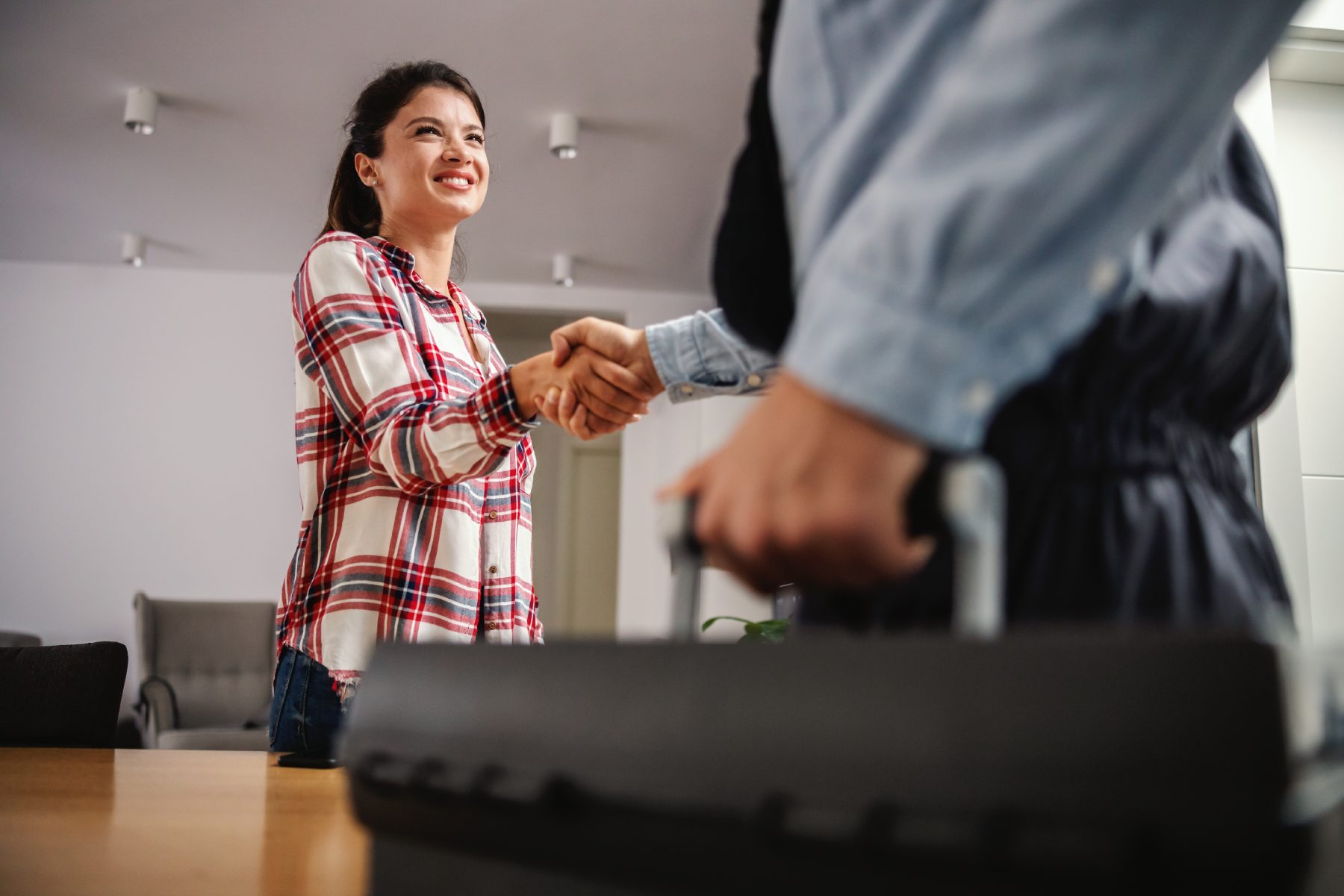 Woman and man shaking hands